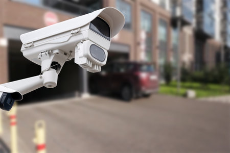 Closeup CCTV camera monitoring in the cars park. Automated car parking systemの写真素材
