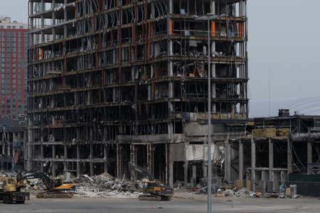 2022 Russian invasion of Ukraine, war-torn city, destroyed car, burned. War in Russia, building...