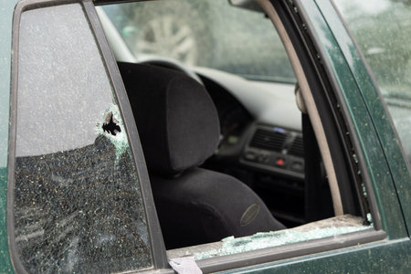 criminal incident. car hack. Broken right side window of car