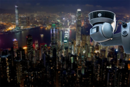 CCTV monitoring, security cameras. Backdrop with views of the city during twilightの写真素材