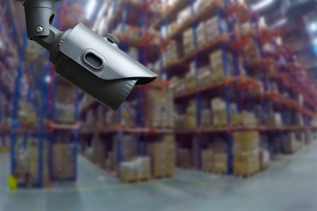 CCTV Camera Operating inside warehouse or factory. copy spaceの写真素材