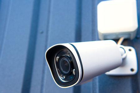 CCTV surveillance camera in factory area to control security system area with torch light and copy...