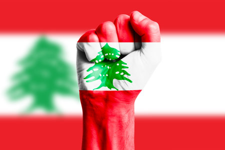 Man hand fist of LEBANON flag painted. Close-upの写真素材