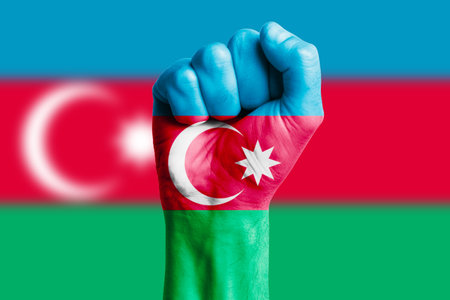 Man hand fist of AZERBAIJAN flag painted. Close-upの写真素材