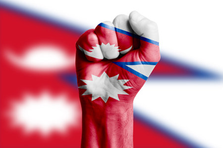 Man hand fist of NEPAL flag painted. Close-upの写真素材