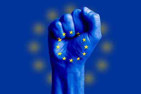 Man hand fist of EUROPE flag painted. Close-up