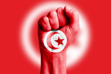 Man hand fist of TUNISIA flag painted. Close-upの写真素材