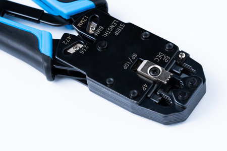 Crimp tool isolated on white background, use for twisted pair network cable with multiple RJ-45 connectorsの写真素材