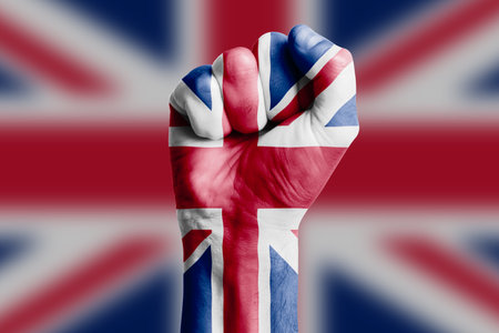 Man hand fist of UNITED KINGDOM flag painted. Close-upの写真素材