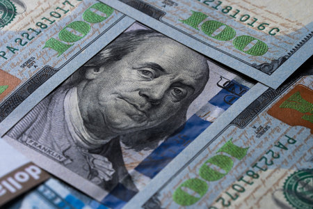 Macro shot of a brand new one hundred dollar bill showing the face of Benjamin Franklinの写真素材