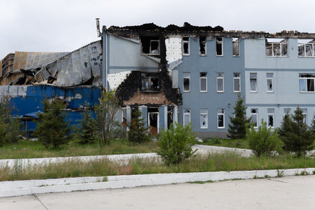 War in Ukraine. Destroyed buildings in the Kyiv region after the attack of the Russian army. Consequences of the Russian invasion of Ukraine. Kyiv region, Ukraine, June 2022のeditorial素材