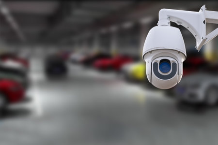 CCTV Camera Operating in car park building. Copy space