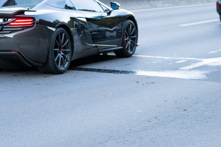 Totaled sports car abandoned on side of Washington state roadの写真素材