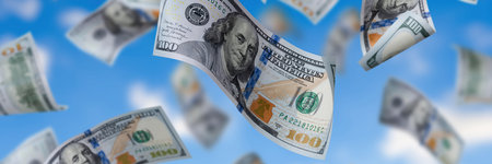 A collection of 100 US dollar bills, each with the new design, floating and flying in the air. This...