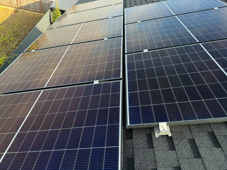 Residential home producing renewable solar energy through rooftop solar panel installation.
