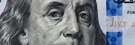clear shot of Benjamin Franklins face on the hundred-dollar bill, capturing intricate design elements.の写真素材