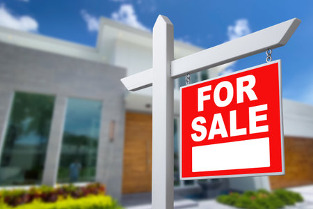 Home For Sale Real Estate Sign and Beautiful New Houseの写真素材