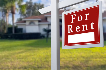 Home for rent. Sign in front of new homeの写真素材