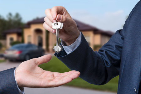 Handing the home keys between realtor and new owner. sale conceptの写真素材