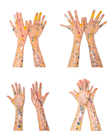 Woman hands in paint make a different shapes isolated on white backgroundの写真素材