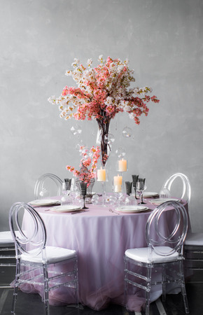 Wedding decoration for banquet with sakura and candles for six personの写真素材