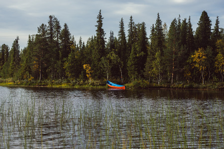 Blue boat on the lakeside in Sweden