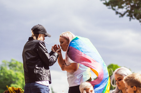 Helsinki, Finland - June 30, 2018: Smoking participants in Kaivopuisto garden on Helsinki pride festivalのeditorial素材