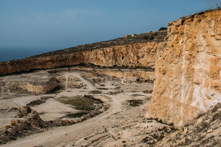 View to stone quarry, sea on background, Maltaの写真素材