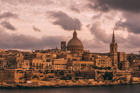 Beautiful view from Sliema to Valletta in the evening, Our Lady of Mount Carmel Basilica, Maltaの写真素材