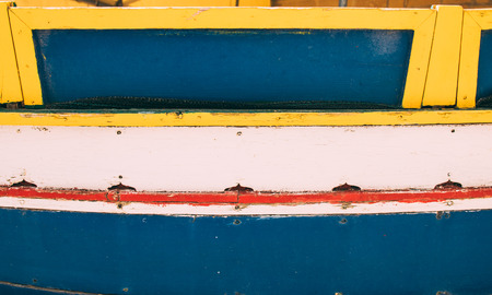 Wooden planks with different paint, boat of Marsaxlokk, Malta, use as natural backgroundの写真素材