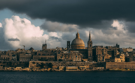 Beautiful view from Sliema to Valletta in the evening, Our Lady of Mount Carmel Basilica, Malta