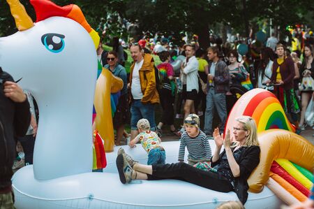 Helsinki, Finland - June 29, 2019:  Kids having fun on inflatable unicorn on Helsinki Pride festival in Kaivopuisto public parkのeditorial素材