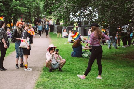Helsinki, Finland - June 29, 2019: Young girls making photo on Helsinki Pride festival in Kaivopuisto public parkのeditorial素材