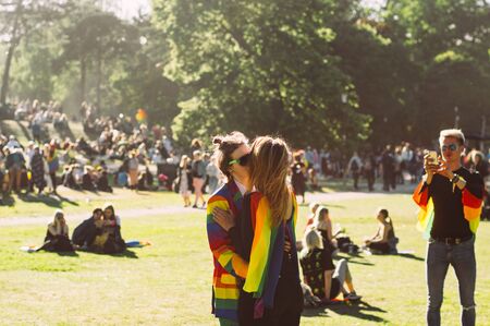 Helsinki, Finland - June 29, 2019: Two girls kissing on Helsinki Pride festival in Kaivopuisto public parkのeditorial素材