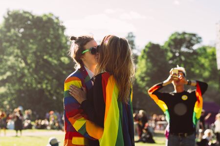 Helsinki, Finland - June 29, 2019: Two girls kissing on Helsinki Pride festival in Kaivopuisto public parkのeditorial素材