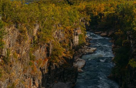 Beautiful view to fast river in Abisko national park in the fall, Swedenの写真素材