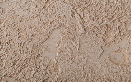 Decorative plaster with marked relief in the antique style in light brown colors