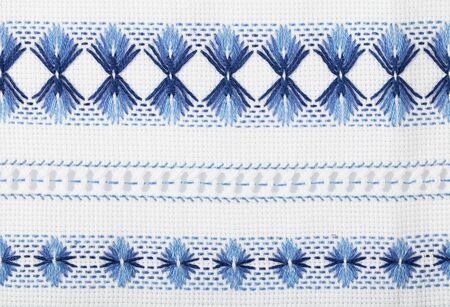 Traditional Ukrainian national pattern. Two-color embroidery on white fabric.