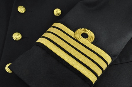 navy uniform with captain rank on a sleeveの写真素材