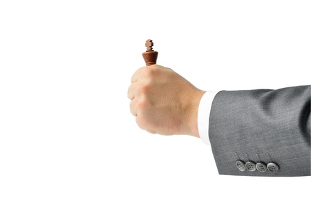 Chess king held in his hand, a man in a suitの写真素材