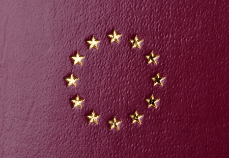 emblem of the European Union on a burgundy backgroundの写真素材