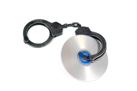 cd / dvd in handcuffs fastened, isolated