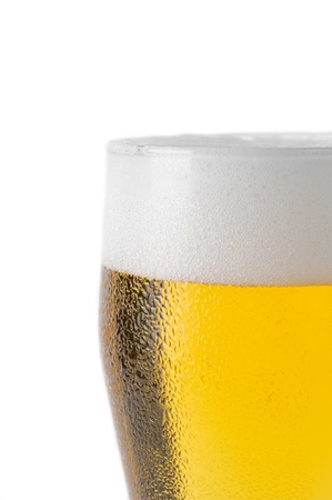 top of beer glass with foam and water dropletsの写真素材