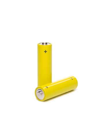 Two yellow batteries isolated on a white background  の写真素材