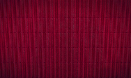 wavy maroon background with vertical stripesの写真素材