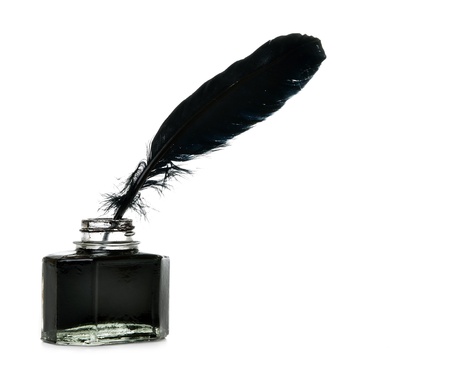 Feather and ink bottle on isolated white backgroundの写真素材