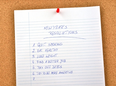 New Year's resolution written and pinned to a cork board
