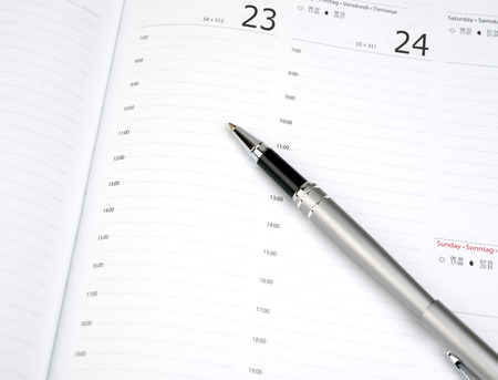 Pen on calendar page closeup の写真素材