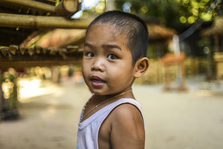 Krabi, Thailand, March 12, 2016: Young boy in Thai village.のeditorial素材