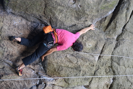 Young female climber climbing a route on a rock. Sokoliki, Polandのeditorial素材